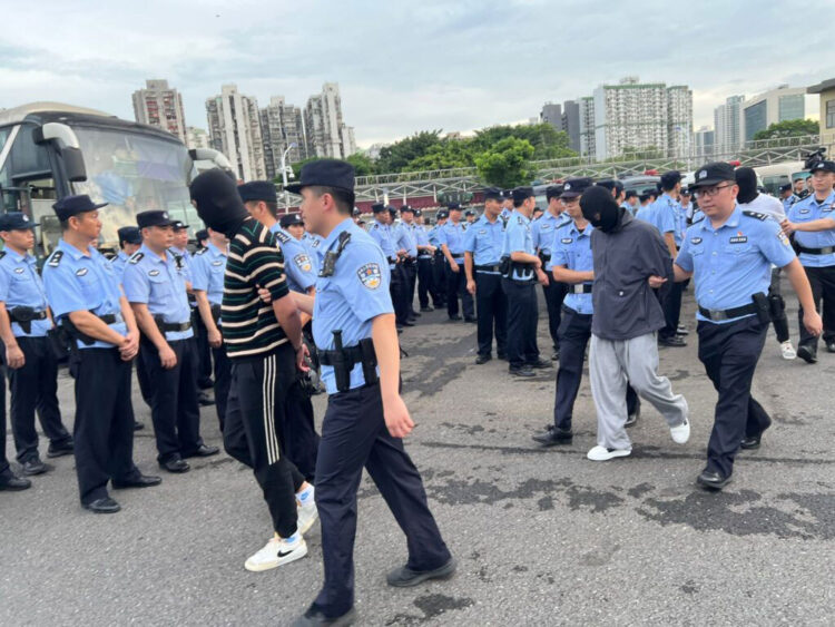 Macau police repatriate 36 money exchange gang members to the mainland