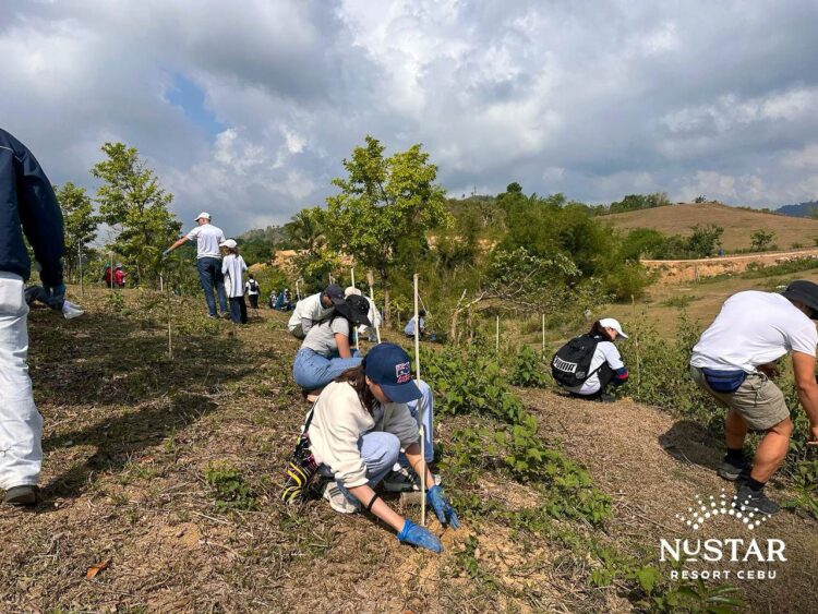 NUSTAR Resort Cebu works with local community on tree-planting activity to support reforestation